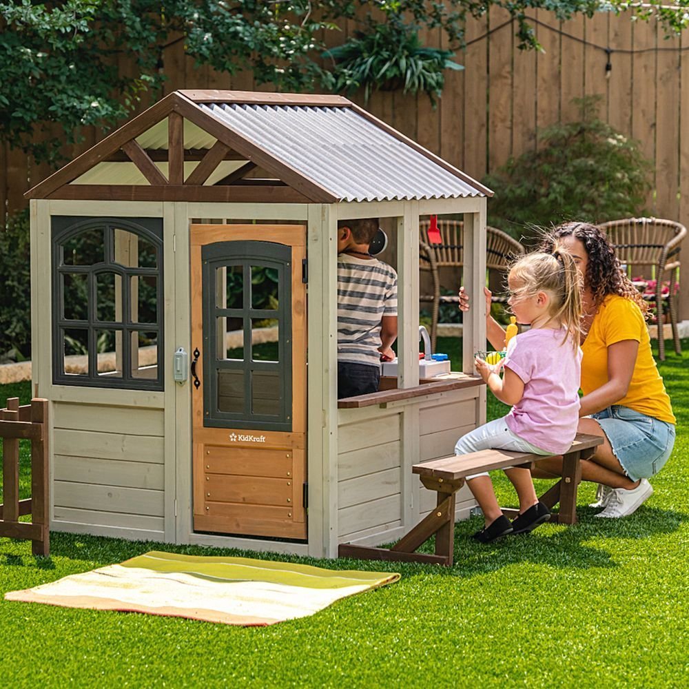 KidKraft Pioneer Cottage Wooden Playhouse – Outdoor Toy for Kids, Playhouse with Porch
