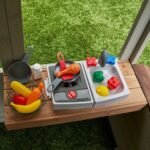 KidKraft Pioneer Cottage Wooden Playhouse – Outdoor Toy for Kids, Playhouse with Porch