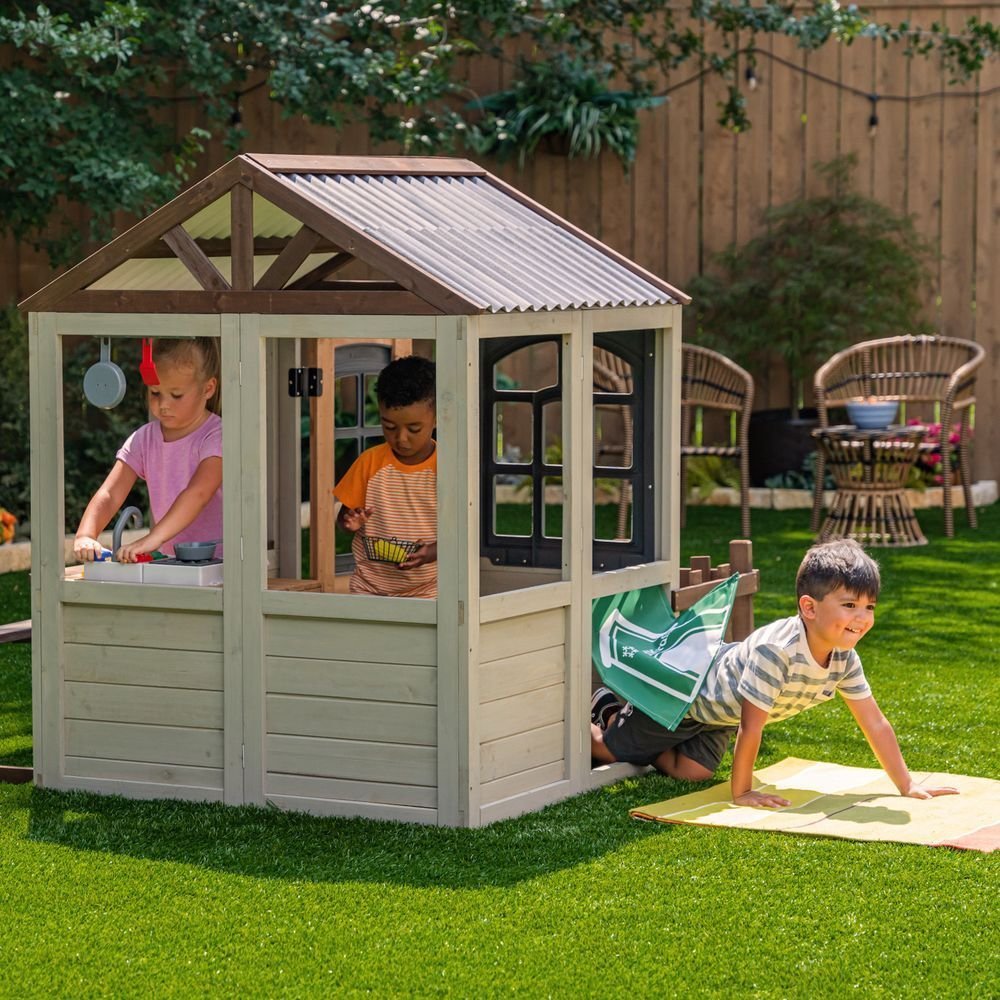 KidKraft Pioneer Cottage Wooden Playhouse – Outdoor Toy for Kids, Playhouse with Porch