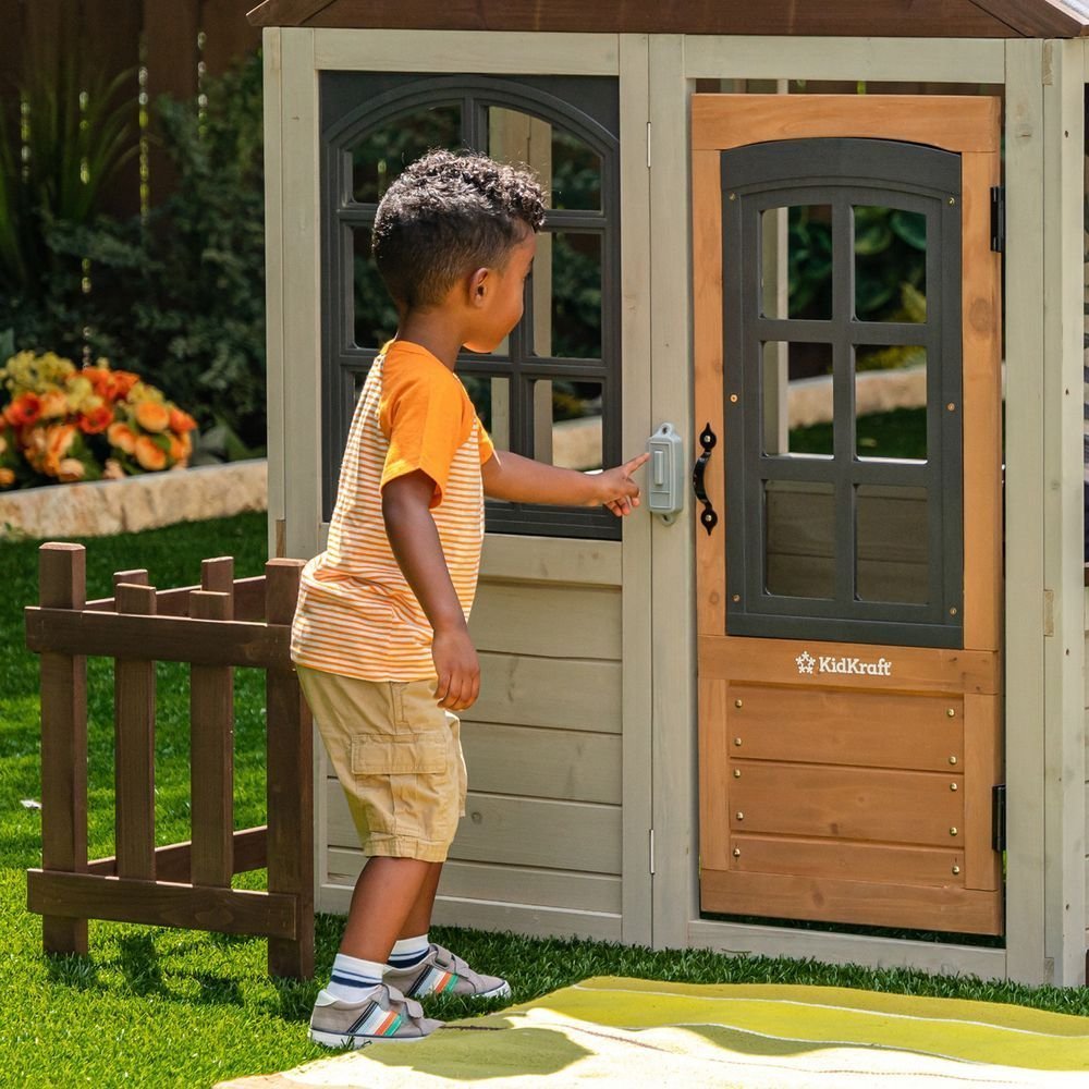 KidKraft Pioneer Cottage Wooden Playhouse – Outdoor Toy for Kids, Playhouse with Porch